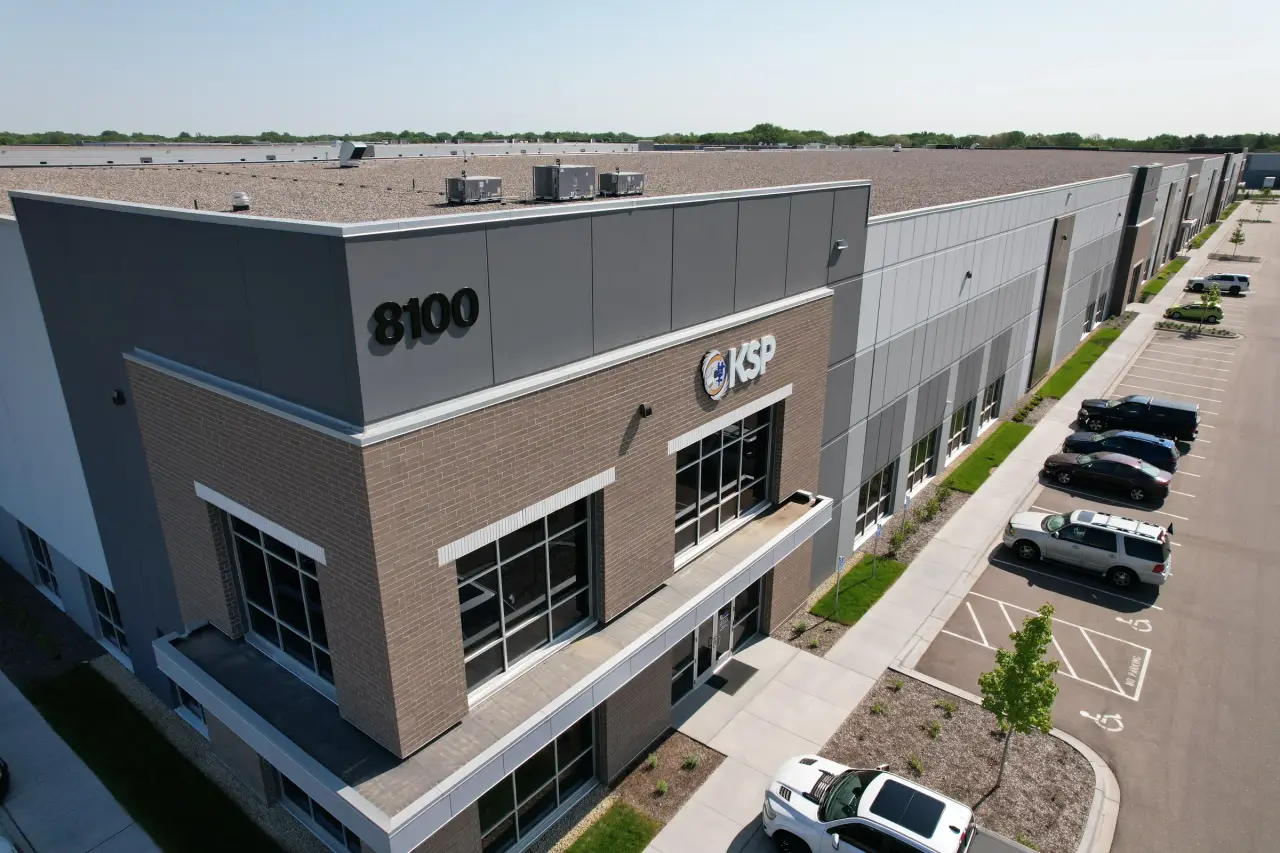 Aerial view of the KSP headquarters building at 8100 Oxbow Creek Dr, with the KSP logo on the corner
